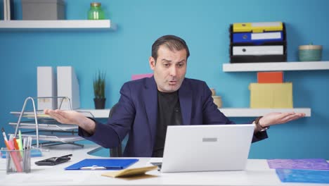 Businessman-working-on-laptop-unhappy-and-negative.